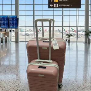 deux valises de marque tito (grande et petite ) de couleur rose avec bande beige